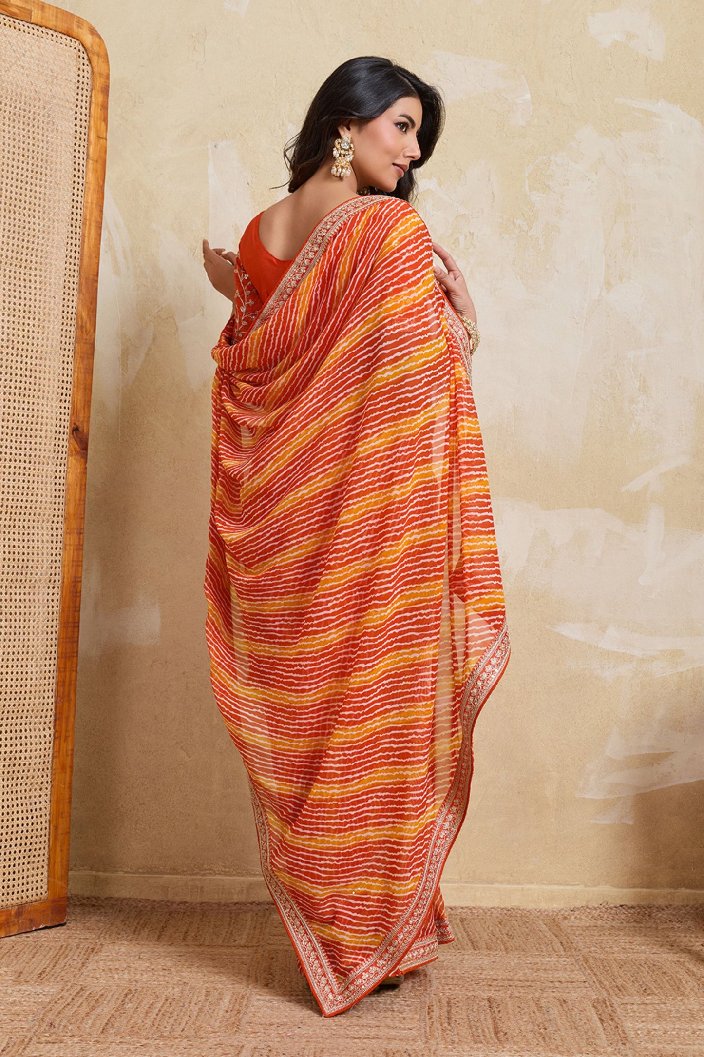 Orange Georgette Saree with Golden Embroidered Border Designer Blouse