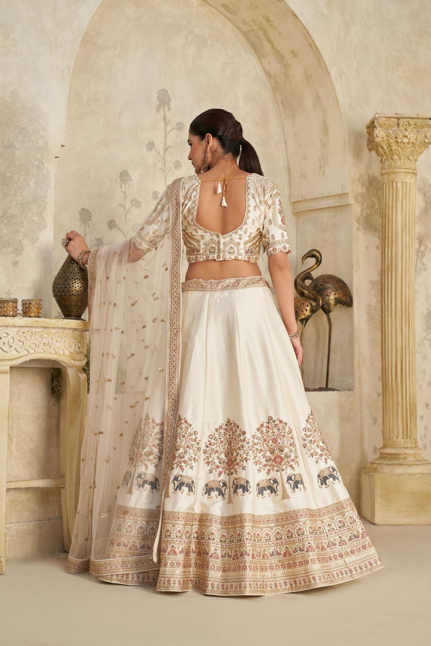 Elegant Cream Silk Embroidered Lehenga Choli with Elephant Motif and Dupatta for Wedding