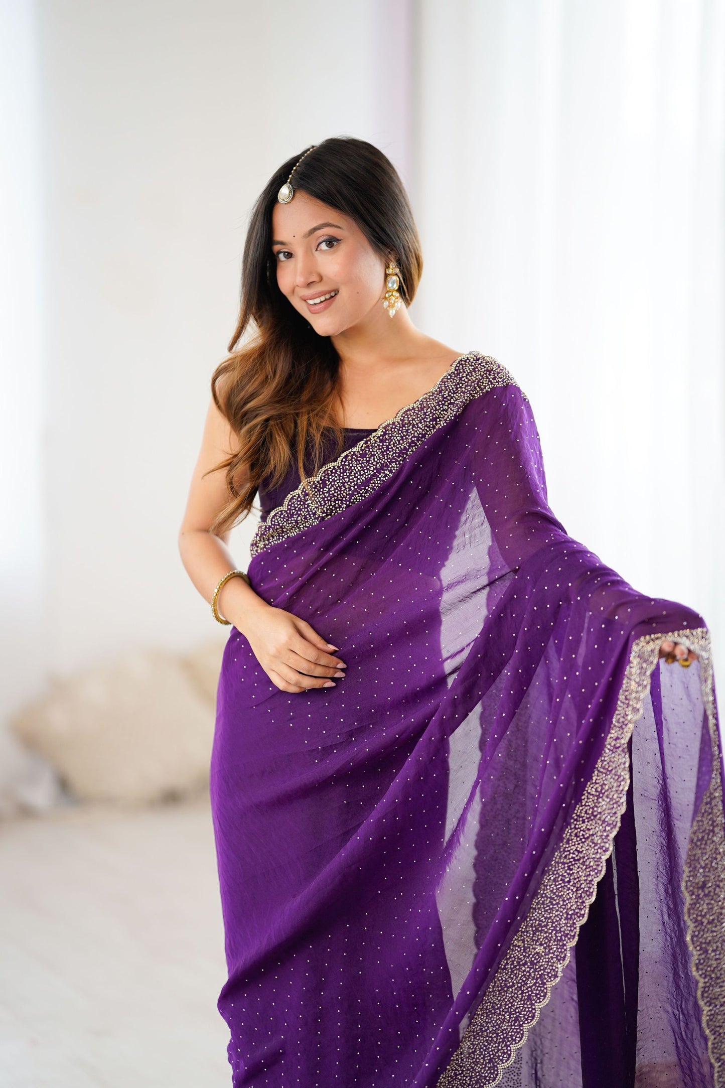 Elegant Purple Georgette Saree with Heavy Embellished Border
