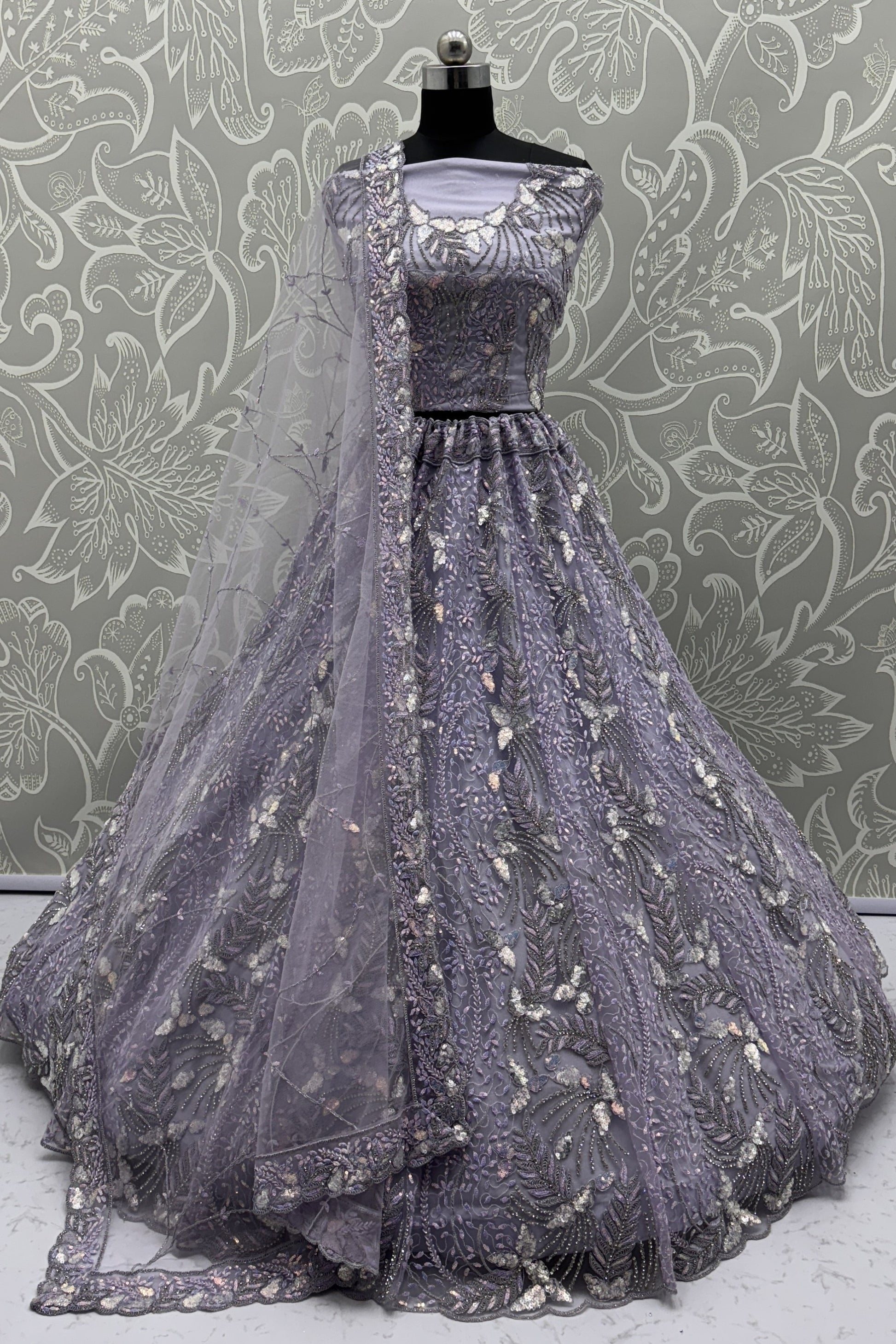 Elegant Lavender Net Bridal Lehenga Choli with Heavy Sequins and Thread Embroidery