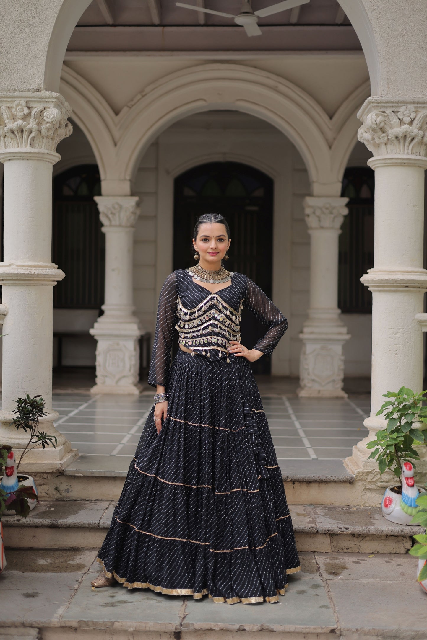 Stylish Black Bandhani Print Faux Georgette Lehenga Choli with Mirror Work