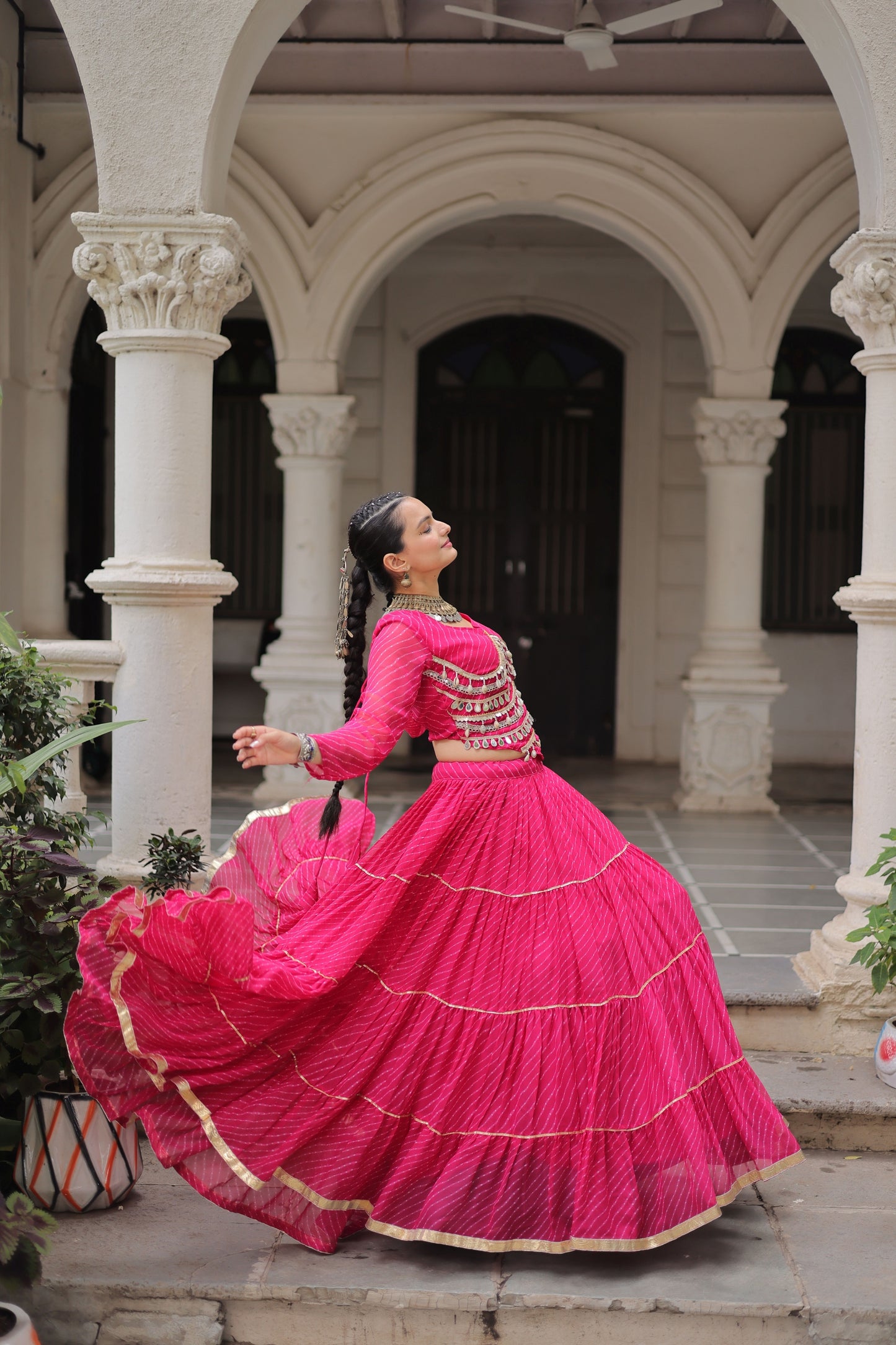 Vibrant Rani Pink Bandhani Print Faux Georgette Lehenga Choli with Mirror Work
