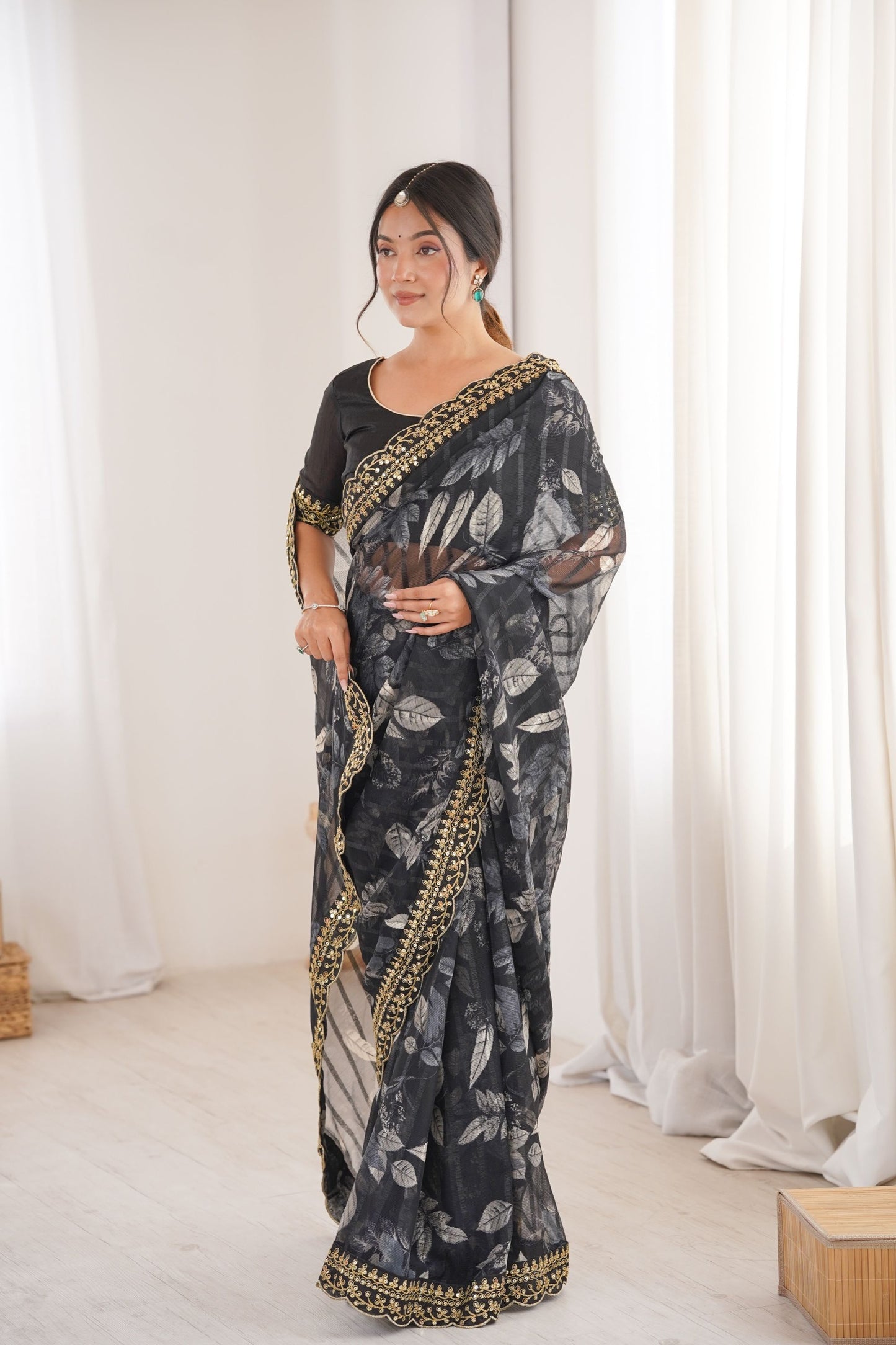 Black Georgette Saree with Golden Embroidered Border Leaf Print