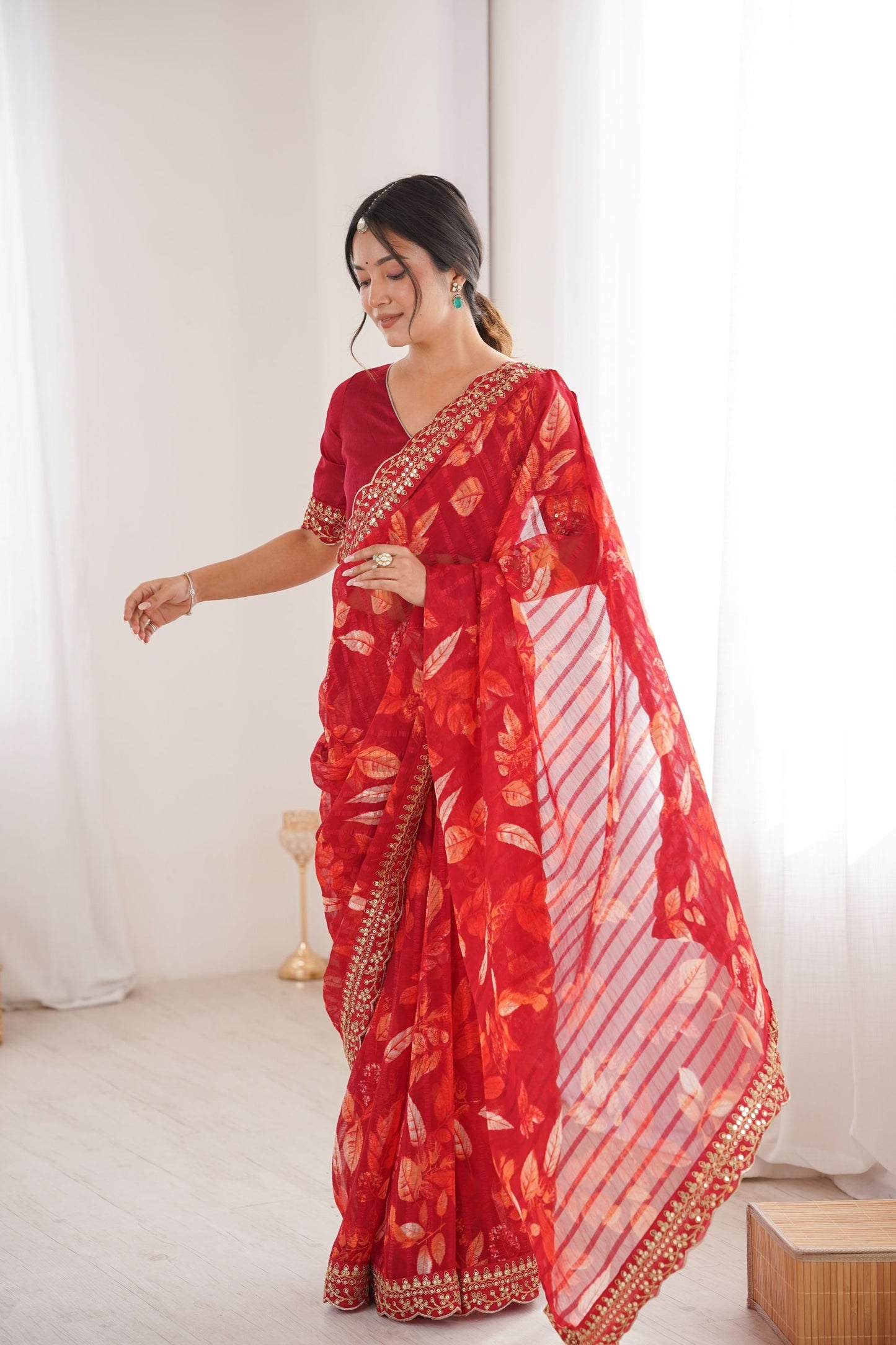 Red Georgette Leaf Print Saree with Golden Embroidered Border