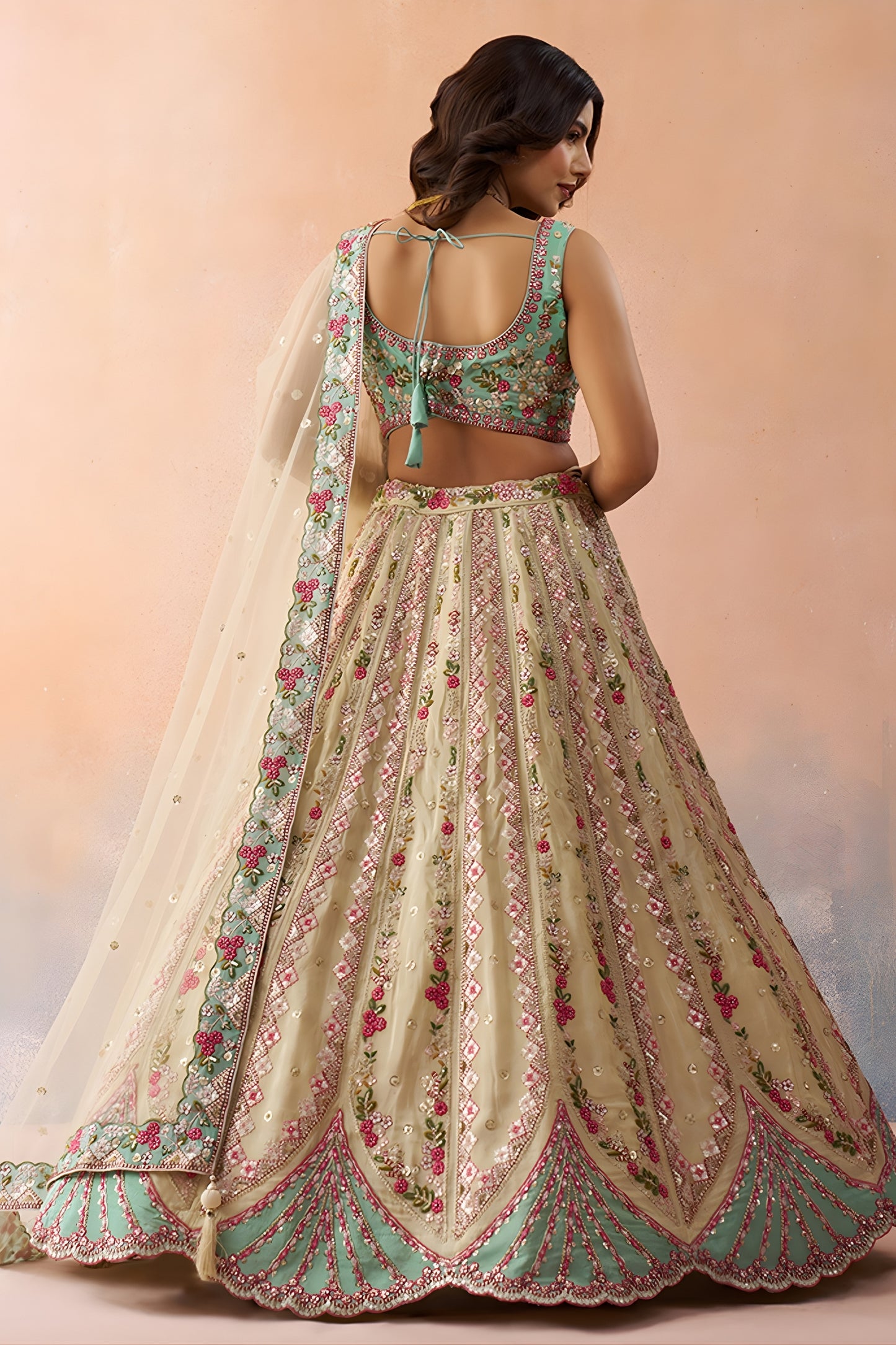 Stunning Cream Embroidered Lehenga Choli with Mint Green Blouse and Net Dupatta