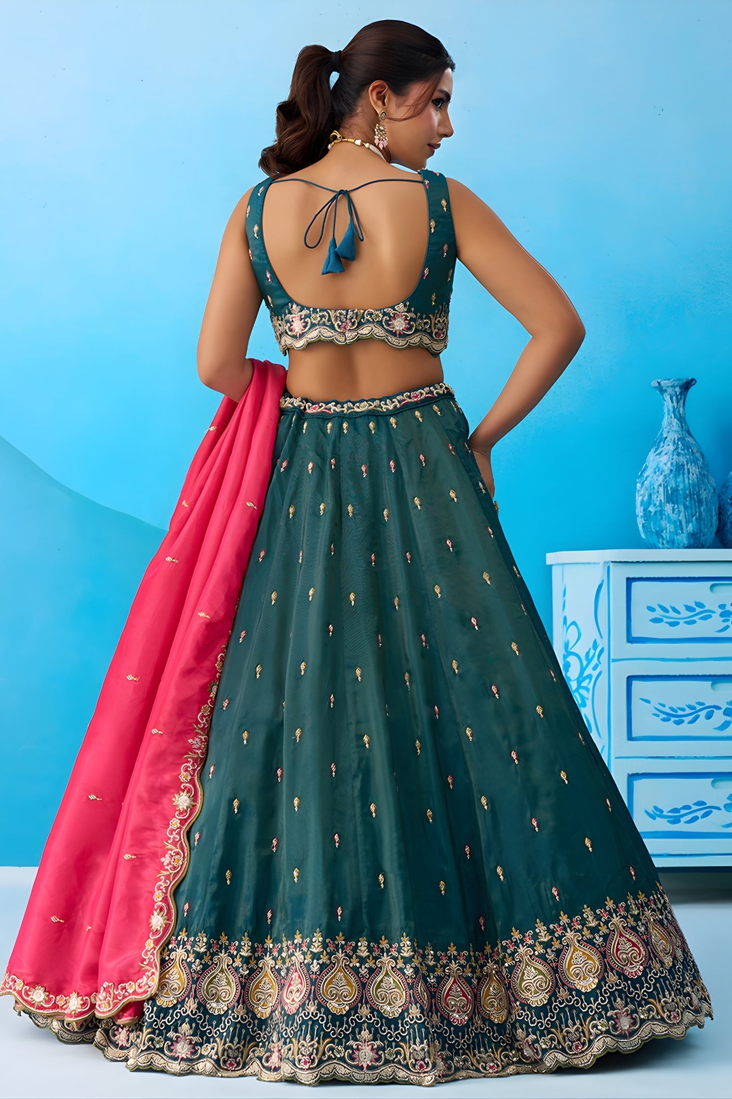 Luxurious Dark Green Cosmos Silk Embroidered Lehenga Choli with Pink Dupatta