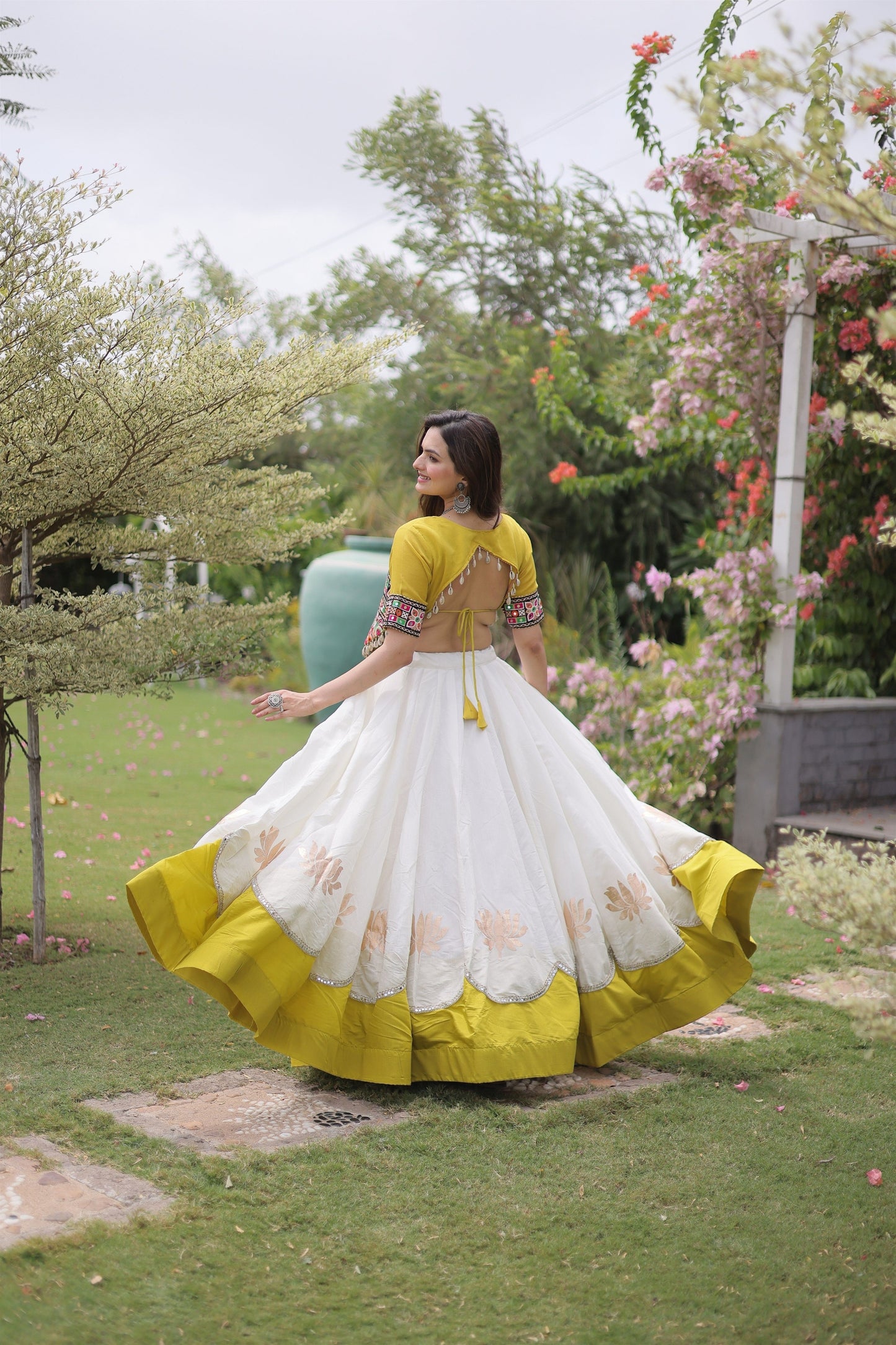 Impressive White and Yellow Roman Silk Navratri Lehenga Choli with Kutchi Gamthi Embroidery Work