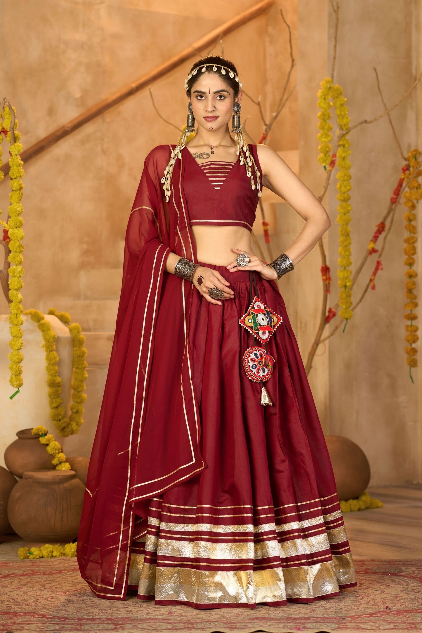 Maroon Silk Navratri Lehenga Choli with Gold Zari Border and Sleeveless Blouse