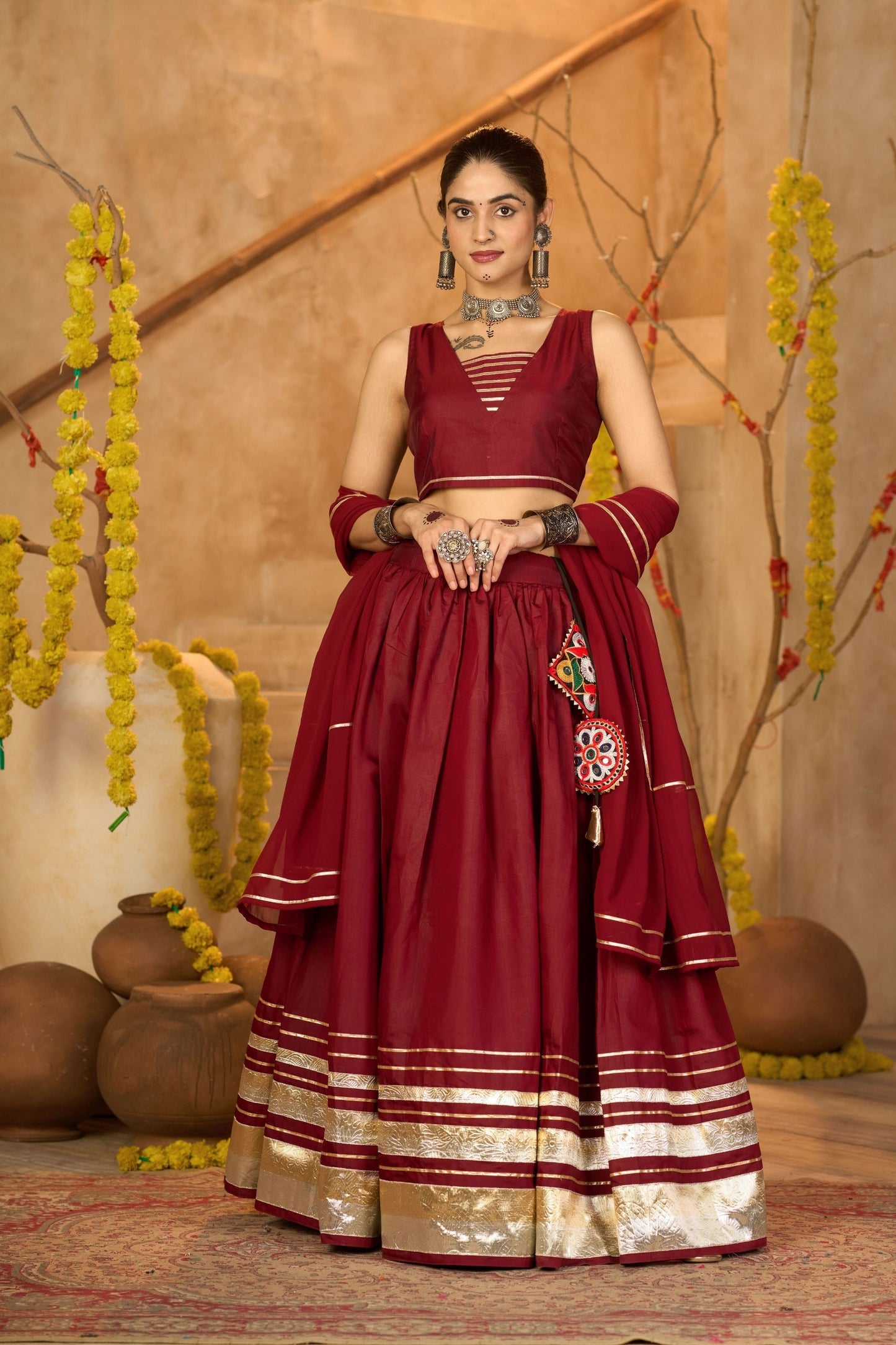 Maroon Silk Navratri Lehenga Choli with Gold Zari Border and Sleeveless Blouse