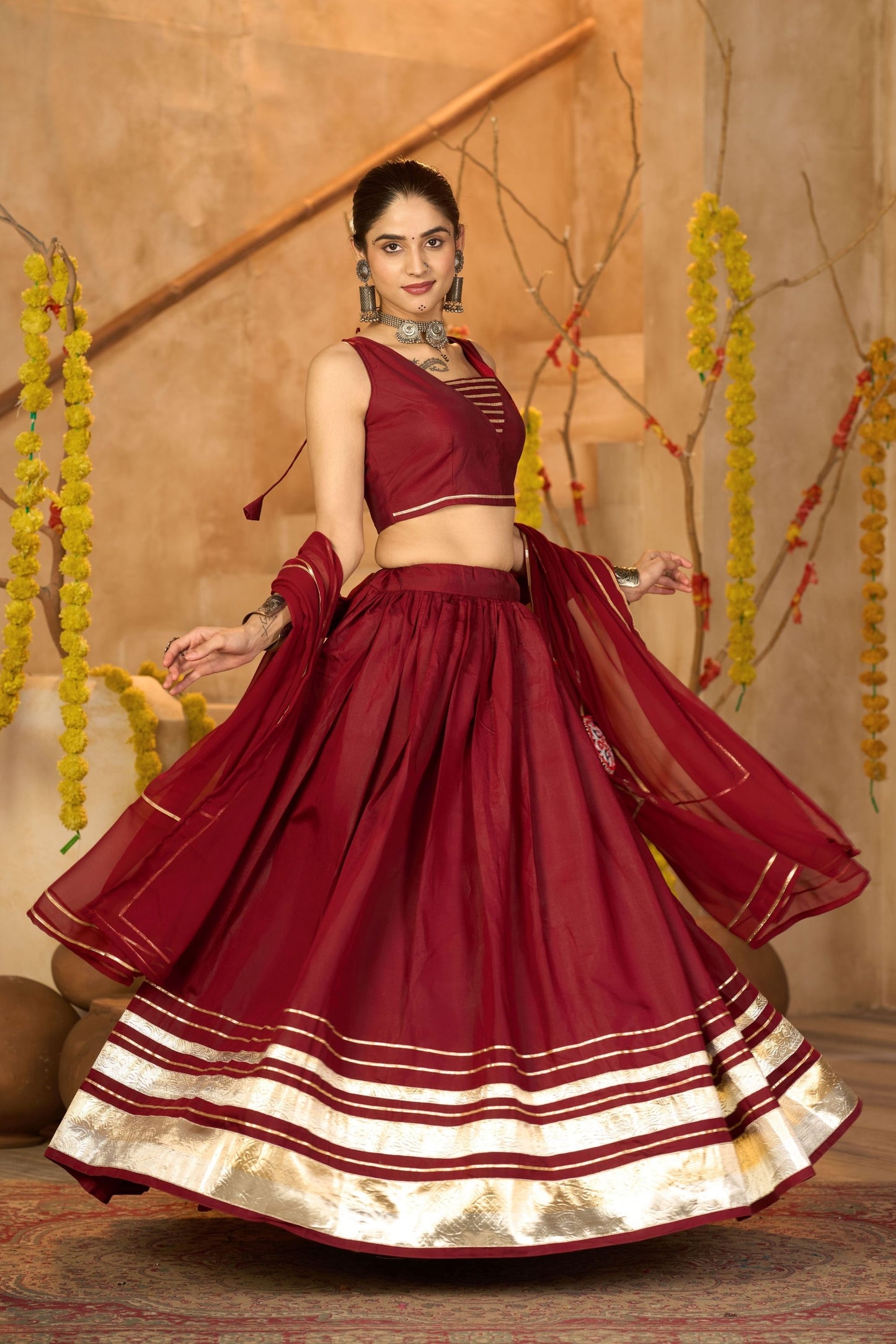 Maroon Silk Navratri Lehenga Choli with Gold Zari Border and Sleeveless Blouse