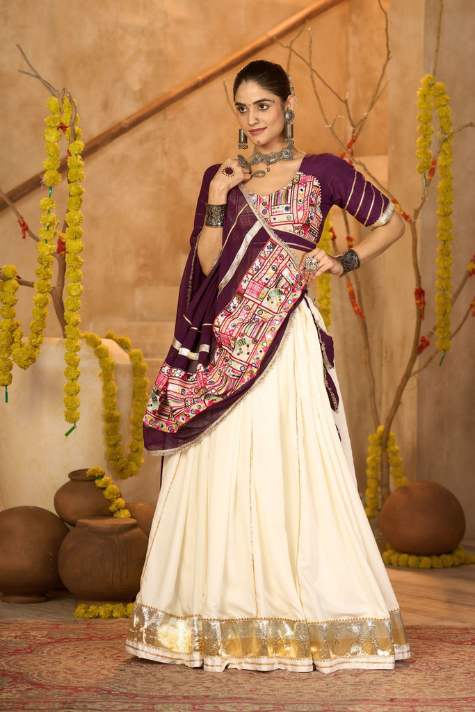 Cream Silk Navratri Lehenga Choli with Gold Zari Border and Purple Dupatta