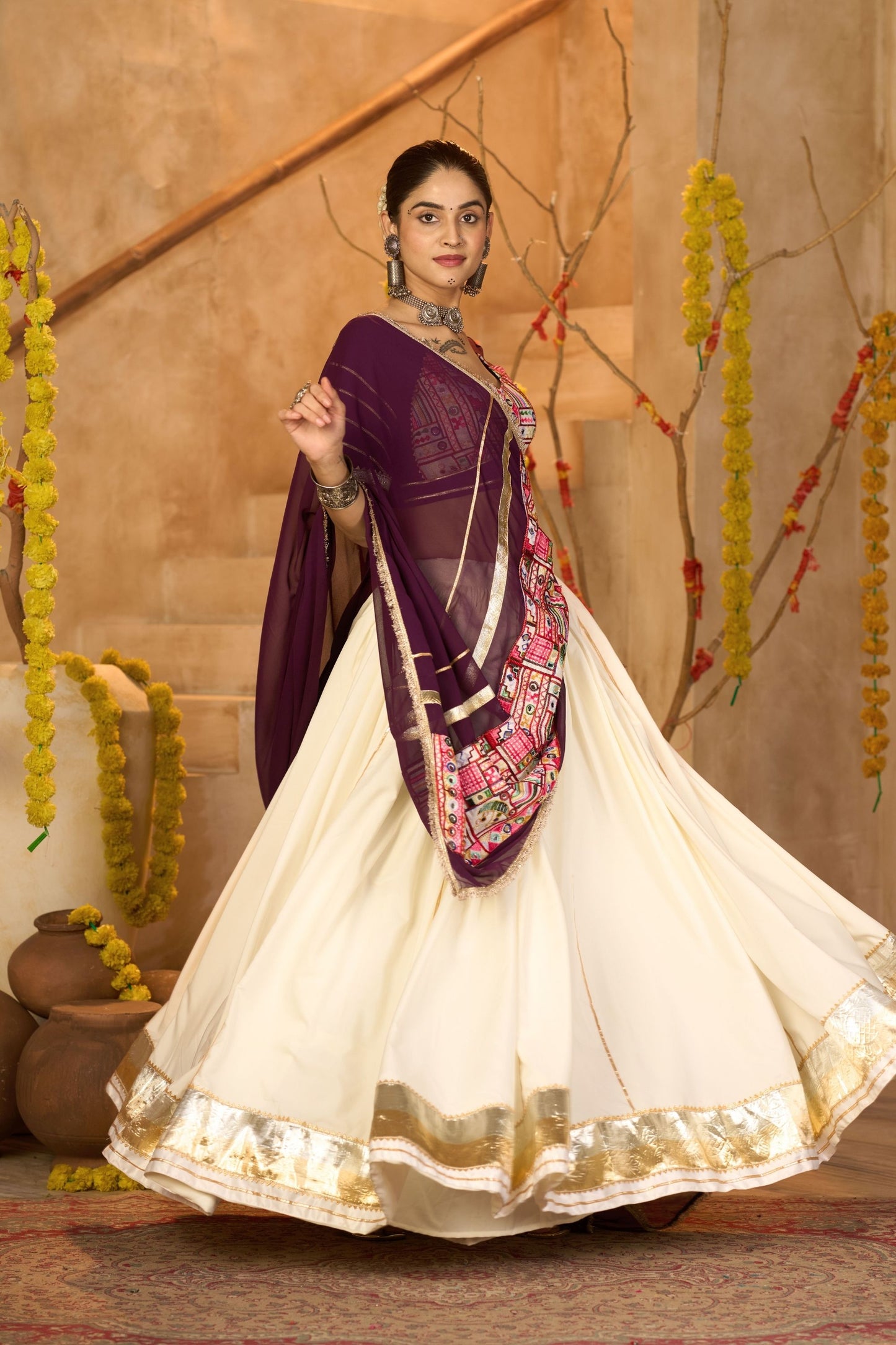 Cream Silk Navratri Lehenga Choli with Gold Zari Border and Purple Dupatta