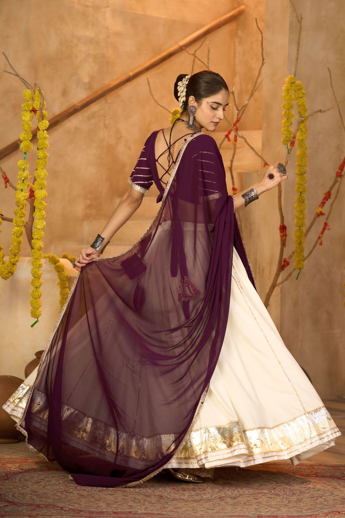 Cream Silk Navratri Lehenga Choli with Gold Zari Border and Purple Dupatta