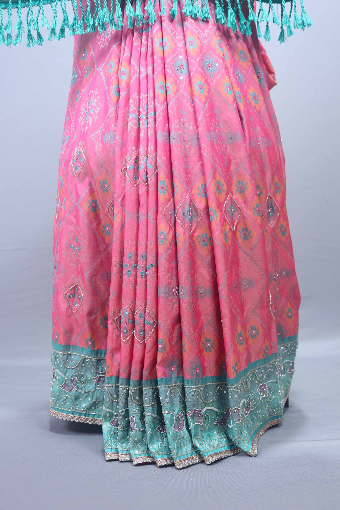 Designer Pink Saree with Teal Embroidered Pallu and Tassel Border