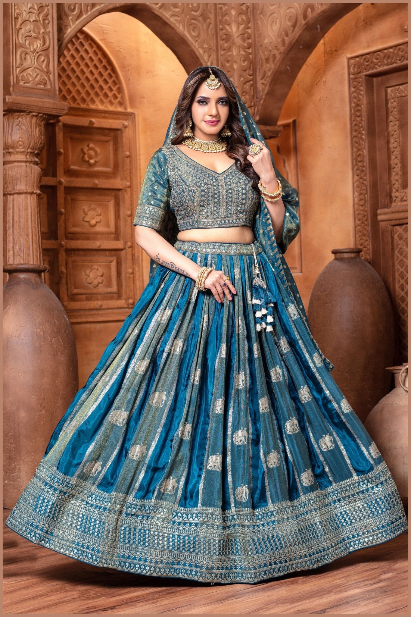 Banarasi Tissue Pleated Teal Blue Lehenga with Floral Woven Motifs - Mangaldeep NX