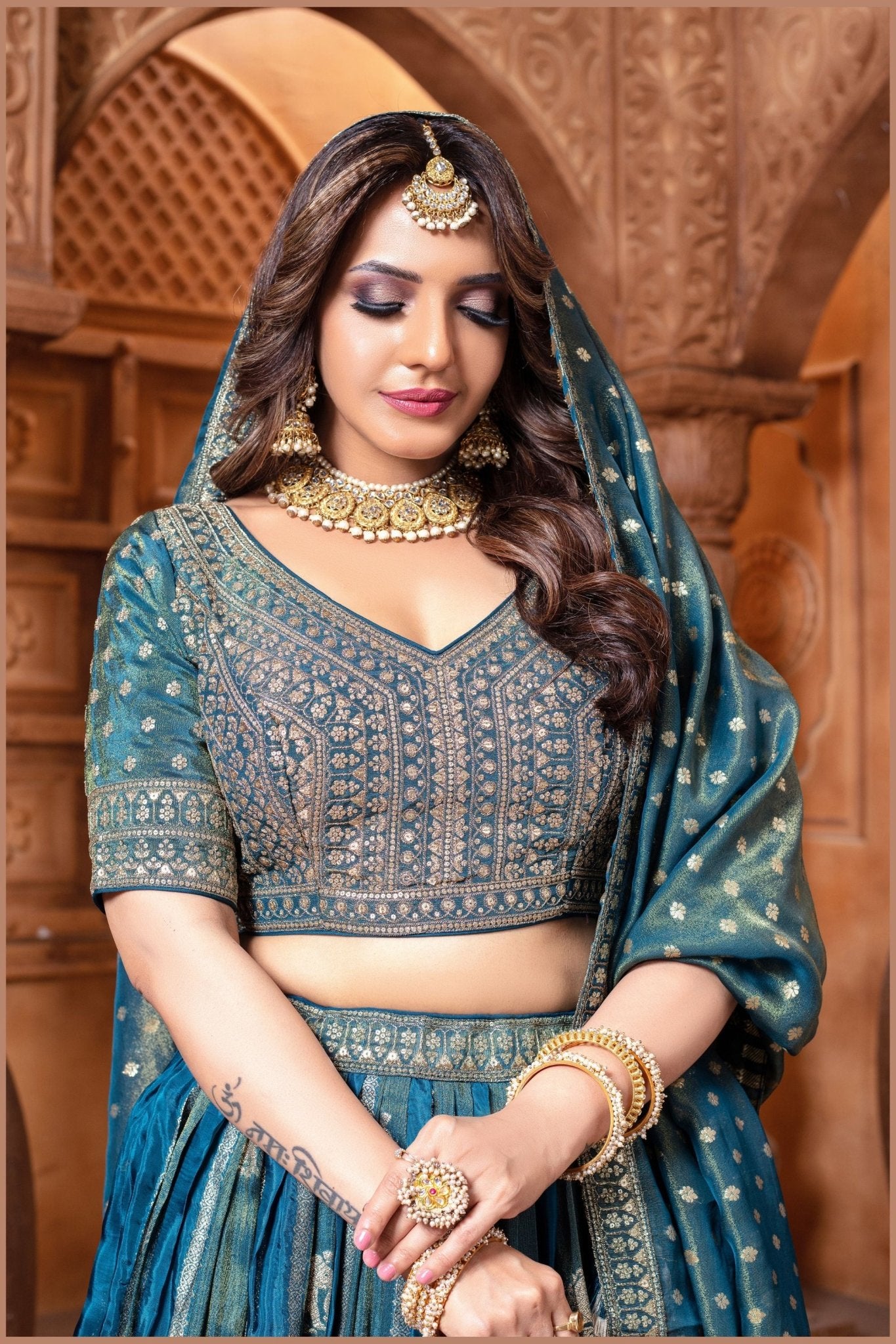 Banarasi Tissue Pleated Teal Blue Lehenga with Floral Woven Motifs - Mangaldeep NX