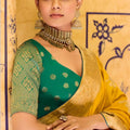 Mustard Yellow Banarasi Silk Saree with Golden Zari Contrast Green Blouse