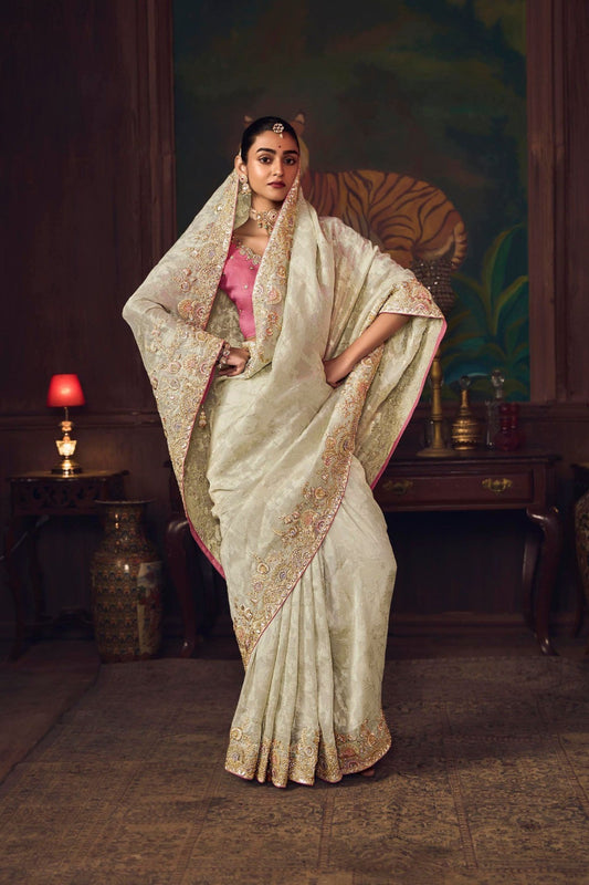 Off-White Silk Saree with Heavy Border Contrast Pink Blouse