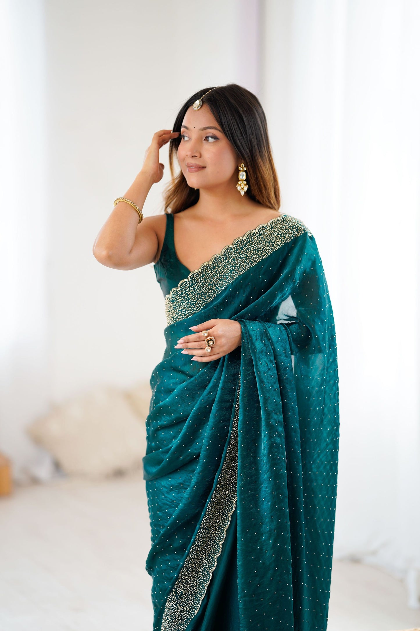 Teal Green Designer Georgette Saree with Heavy Golden Embroidered Border