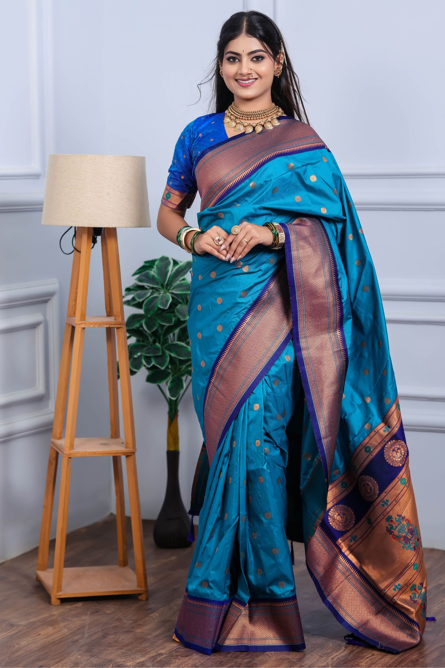 Teal Blue Kanjivaram Silk Saree with Gold Zari Border Butti Work