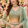 Exquisite Pista Green Fancy Fabric Heavy Embroidered Designer Lehenga Choli with Dupatta for Women