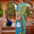Elegant Olive Green Patola Silk Saree with Sky Blue Zari Border 