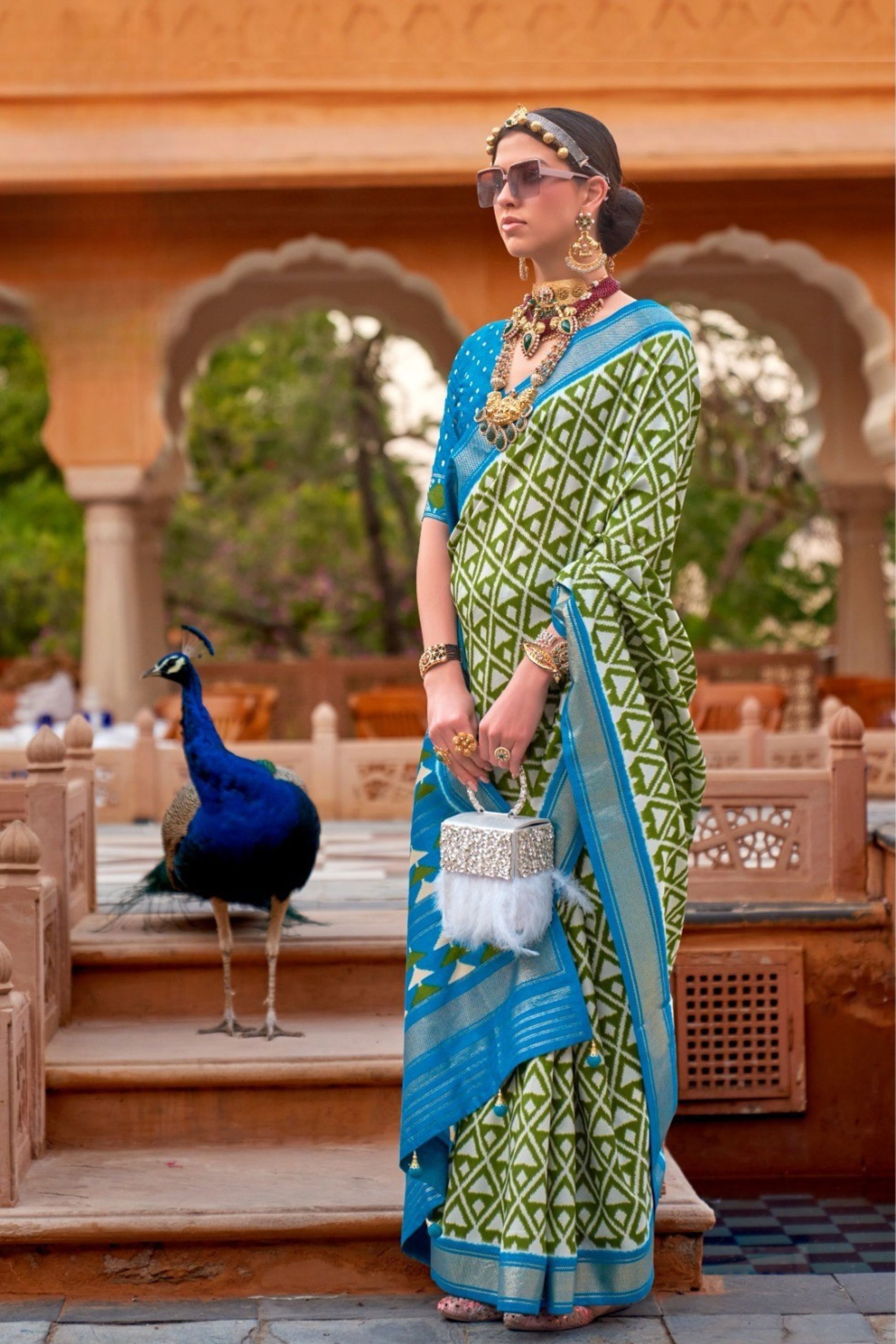 Elegant Olive Green Patola Silk Saree with Sky Blue Zari Border 