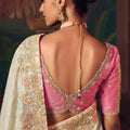 Off-White Silk Saree with Heavy Border Contrast Pink Blouse