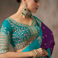 Purple Silk Saree with Contrast Teal Blue Zari Border Traditional
