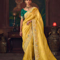 Mustard Yellow Silk Saree with Heavy Border and Green Contrast Blouse –