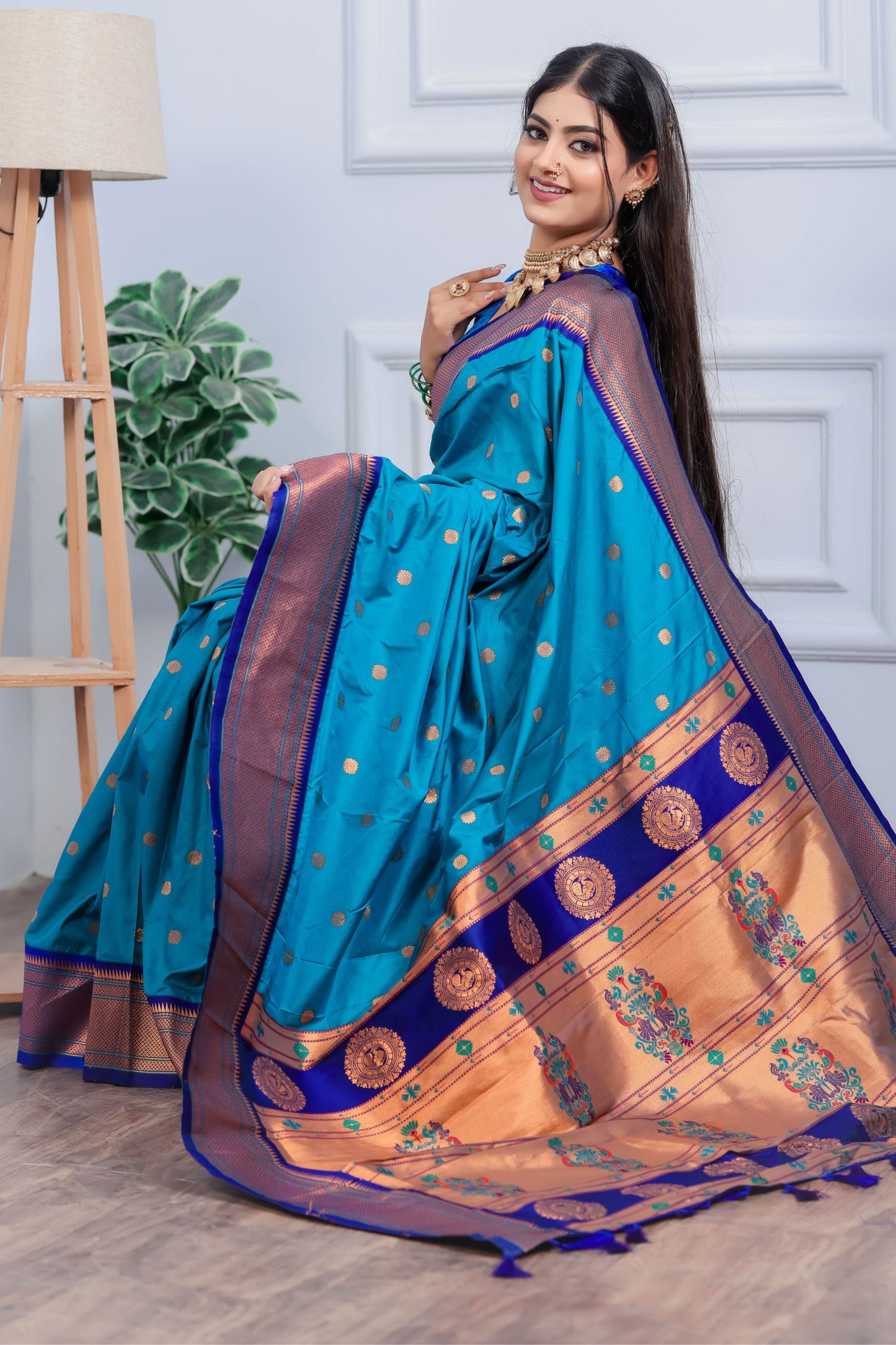 Teal Blue Kanjivaram Silk Saree with Gold Zari Border Butti Work