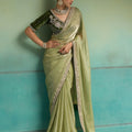 Graceful Pista Green Velvet Satin Beads Piping and Tassel Saree