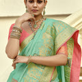 Sea Green Silk Saree with Antique Gold Zari Motifs Contrast Pink Blouse