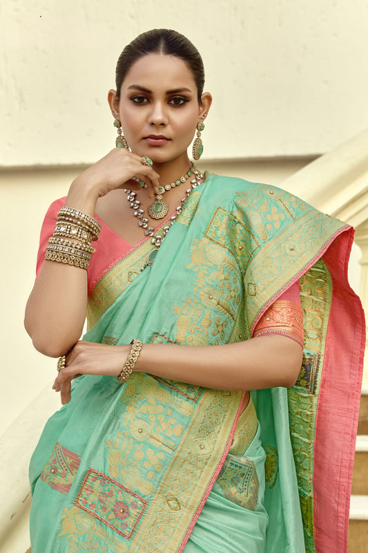 Sea Green Silk Saree with Antique Gold Zari Motifs Contrast Pink Blouse