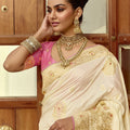Ivory White Silk Saree with Rich Gold Zari Floral Motifs Pink Contrast Border