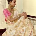 Ivory White Silk Saree with Rich Gold Zari Floral Motifs Pink Contrast Border