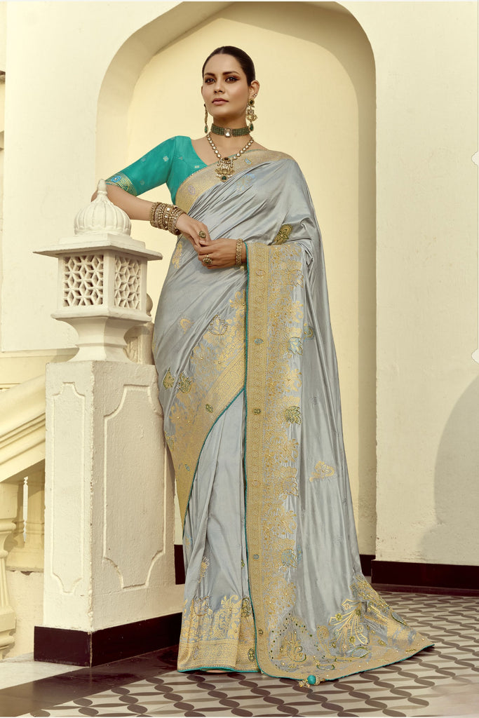 Grey Silk Saree with Rich Gold Zari Embroidery Contrast Teal Blouse