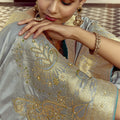 Grey Silk Saree with Rich Gold Zari Embroidery Contrast Teal Blouse