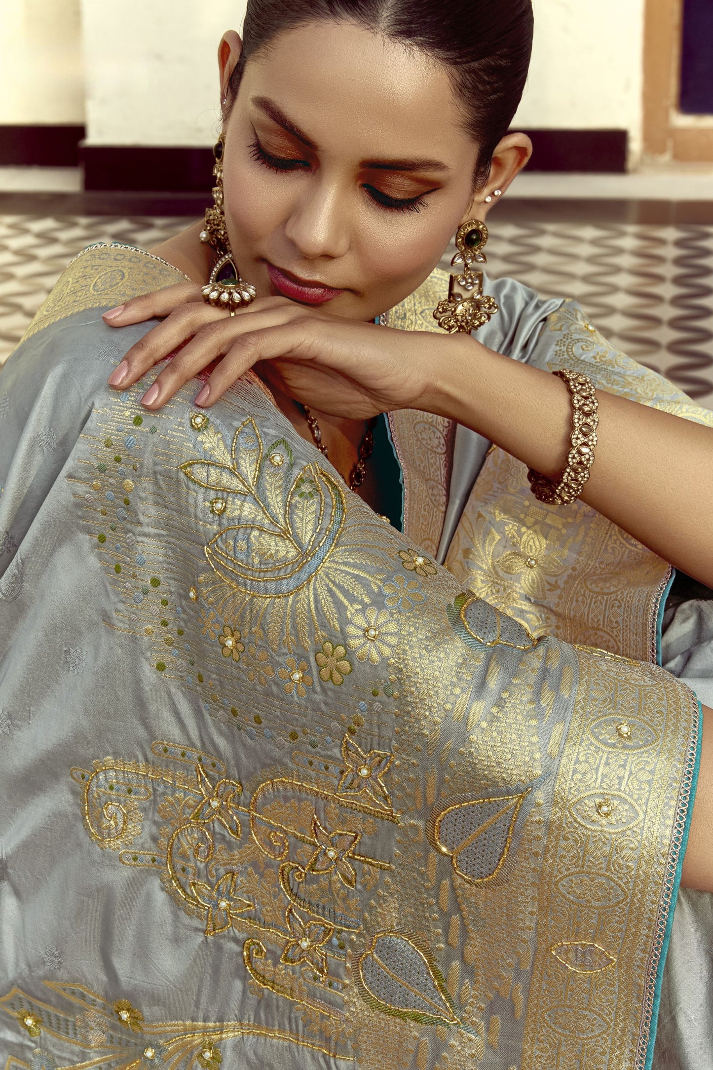 Grey Silk Saree with Rich Gold Zari Embroidery Contrast Teal Blouse