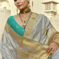 Grey Silk Saree with Rich Gold Zari Embroidery Contrast Teal Blouse
