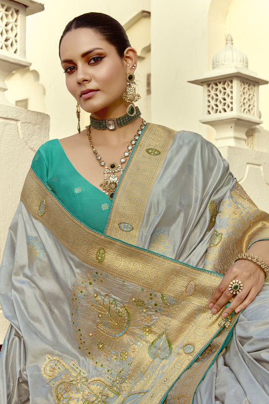 Grey Silk Saree with Rich Gold Zari Embroidery Contrast Teal Blouse