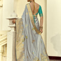 Grey Silk Saree with Rich Gold Zari Embroidery Contrast Teal Blouse