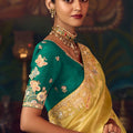 Mustard Yellow Silk Saree with Heavy Border and Green Contrast Blouse –