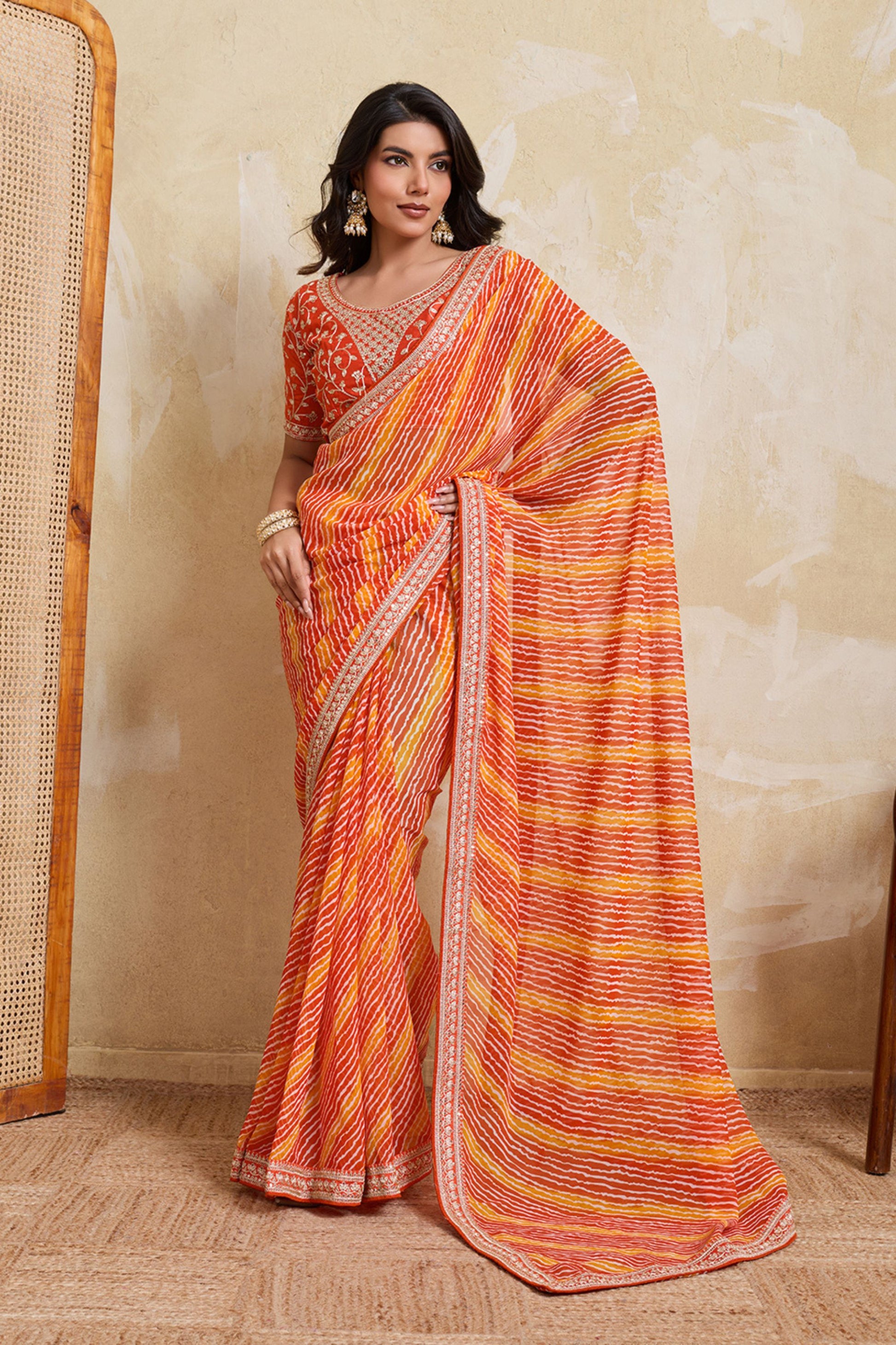 Orange Georgette Saree with Golden Embroidered Border Designer Blouse 