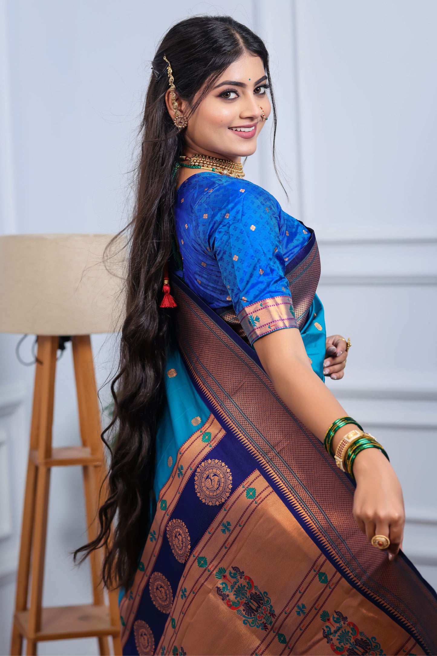 Teal Blue Kanjivaram Silk Saree with Gold Zari Border Butti Work