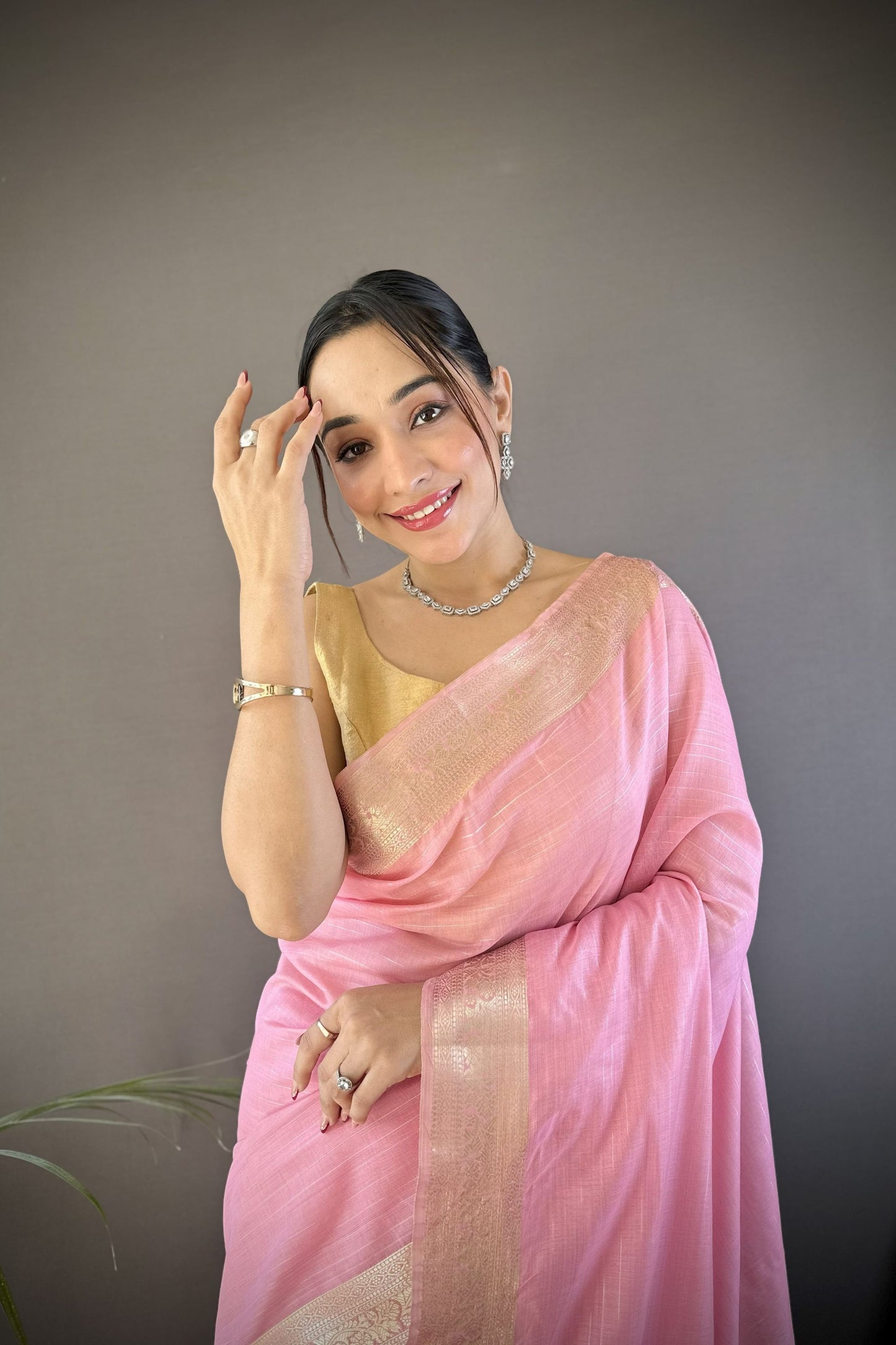 Pink Linen Silk Saree with Golden Zari Border Tassel Pallu