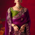 Magenta Purple Heavy Embroidered Saree with Contrast Green Blouse
