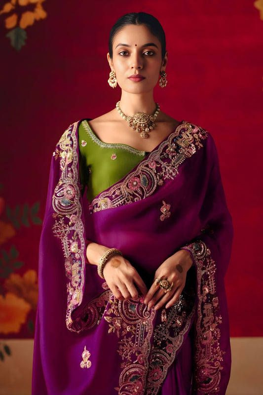 Magenta Purple Heavy Embroidered Saree with Contrast Green Blouse