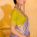 Lavender Banarasi Silk Saree With Golden Zari Contrast Green Blouse
