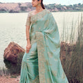 Pastel Mint Green Designer Silk Saree with Heavy Golden Blouse